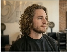 Long flow — men's long hair styled with natural movement and texture