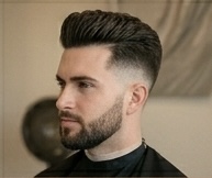Sculpted pompadour — high-volume men's style with clean tapered sides