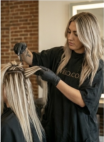 Studio highlight check — precise foil placement reviewed under salon lighting