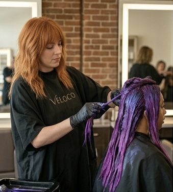 Vivid purple color result — rich violet saturation from root to tip