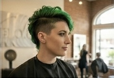 Emerald fade — vibrant green creative color faded into dark roots