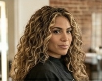 Honey curls — warm honey tones brought to life in a defined curl set